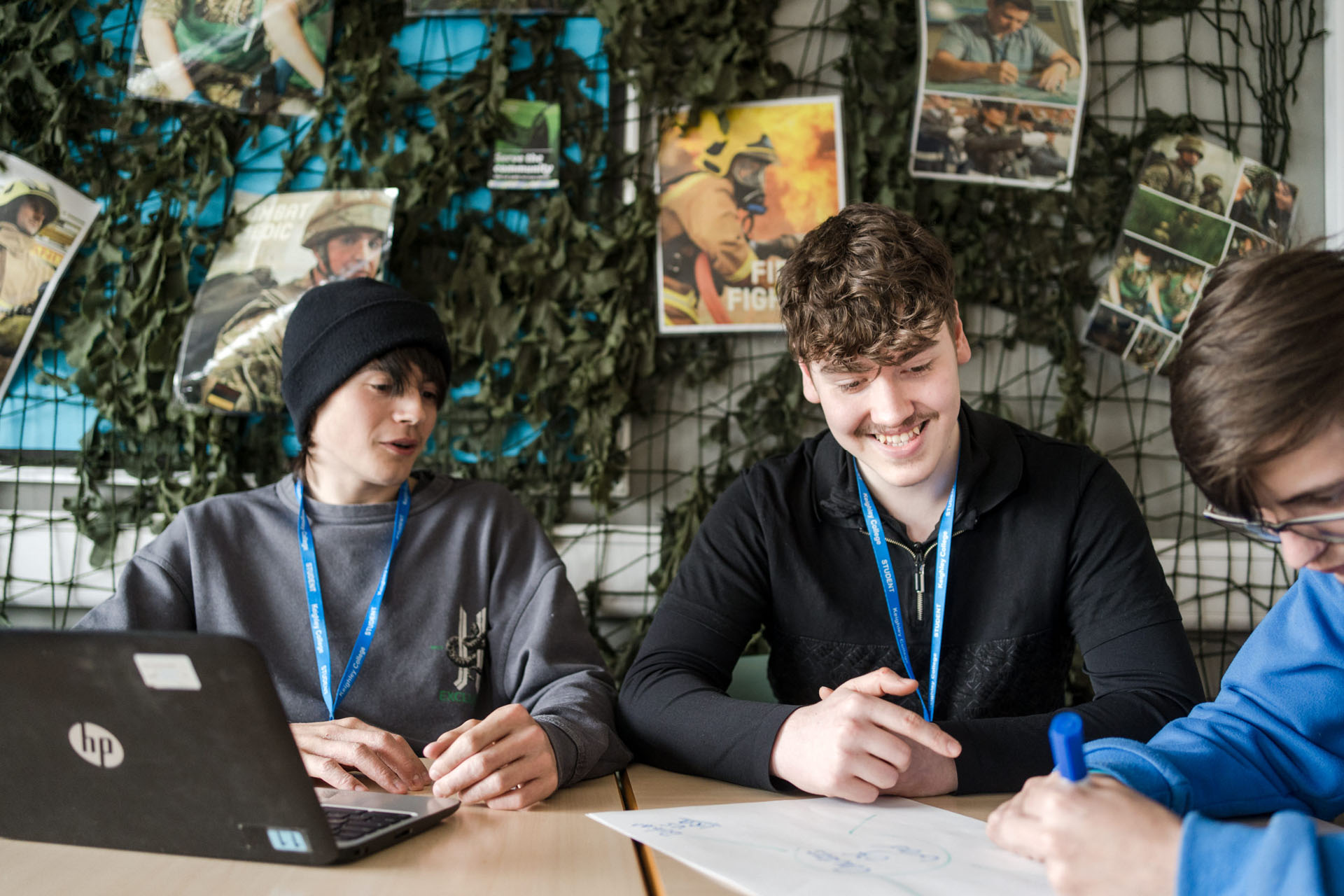 Group of Keighley College students in a class room sat at their desks studying