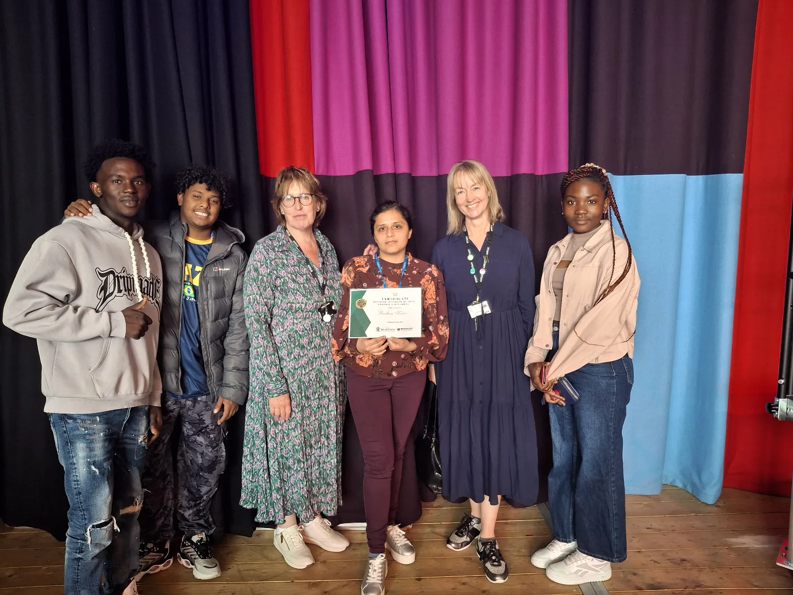 KC students and staff accepting an award for college of sanctuary
