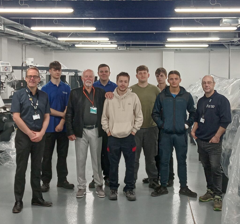 Aviation expert Roger Page with Principal Kevin O'Hare and apprentices at Keighley College