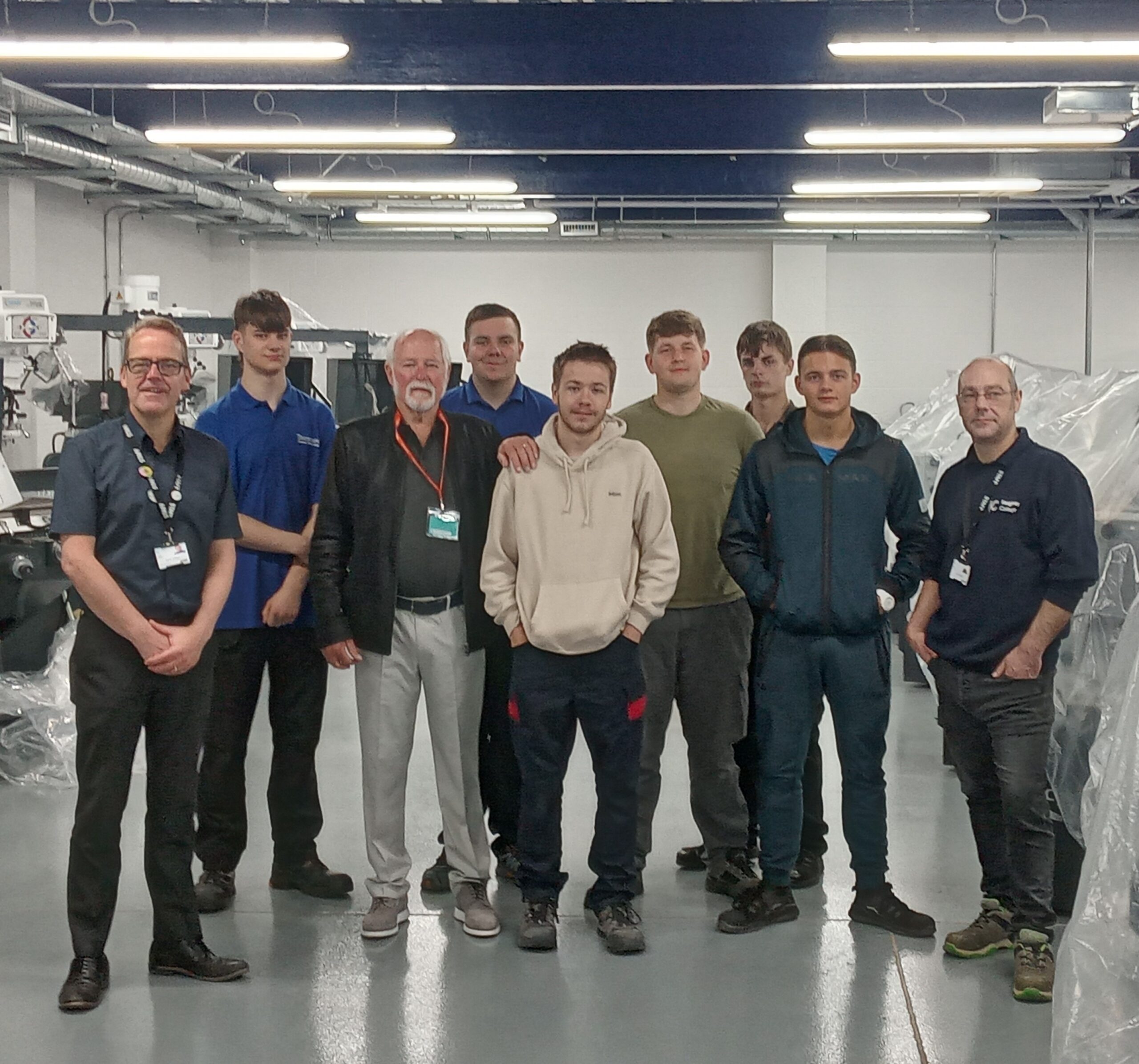 Aviation expert Roger Page with Principal Kevin O'Hare and apprentices at Keighley College