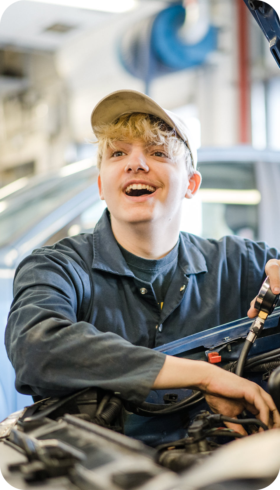 Student working in motor vehicle workshop