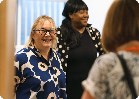 A group of adult learners socialising together